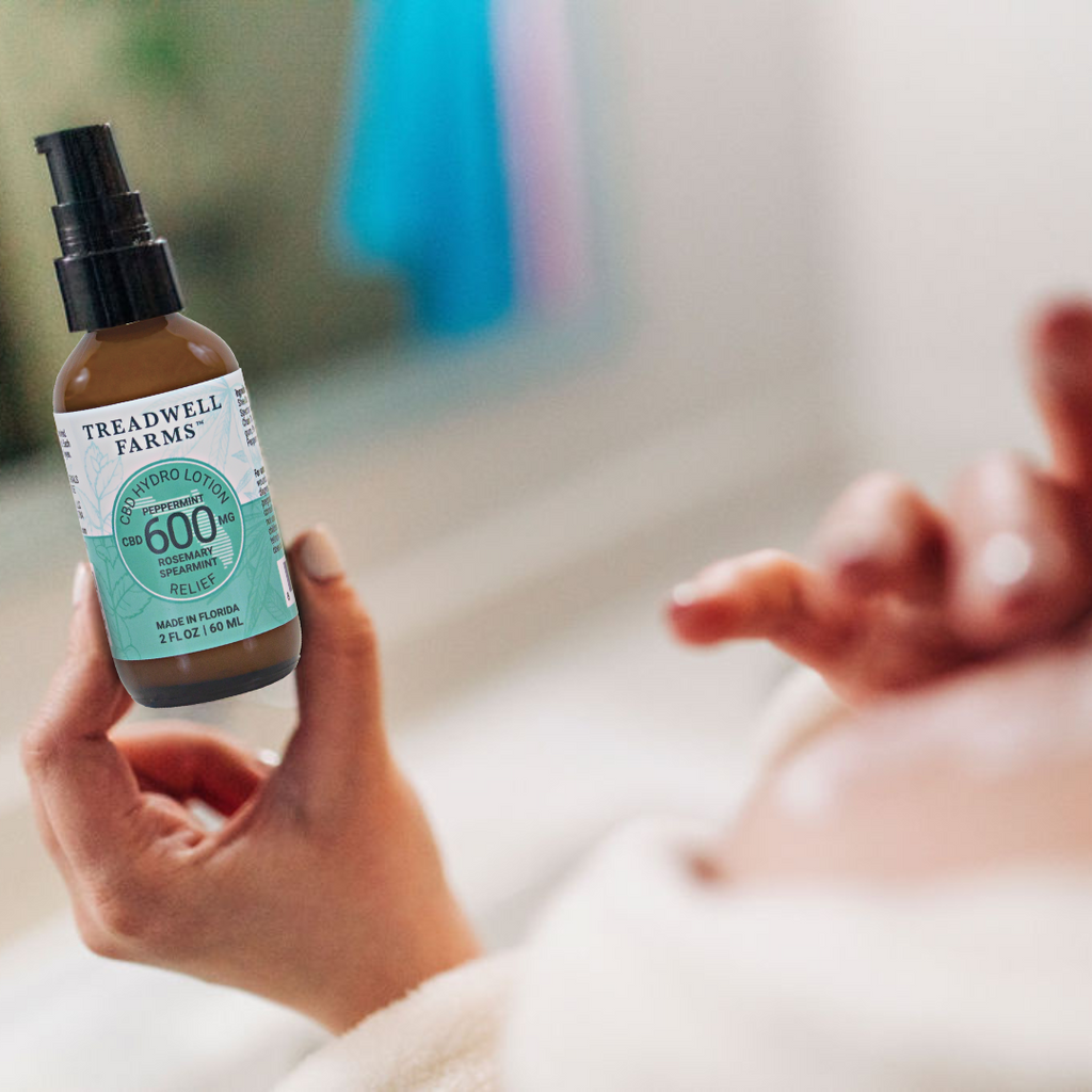 person holding a RELIEF CBD Hydro Lotion bottle