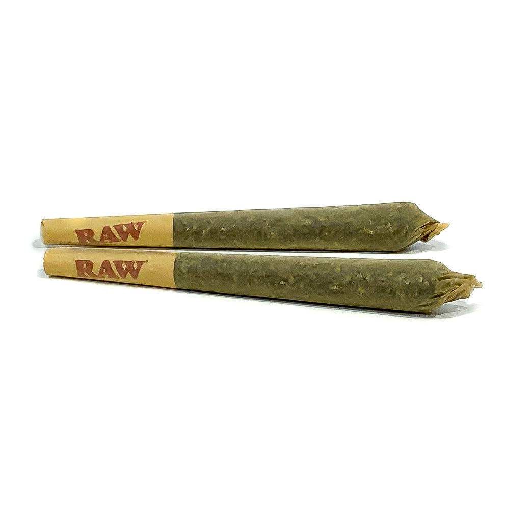 two hemp pre-rolls laying next to each other on a white background